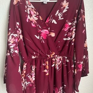 Pink floral romper with long sleeves